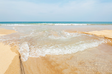Blue sea with white sand beach