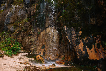 Mountain waterfall in Adygea. Drops of water falling on the rocks