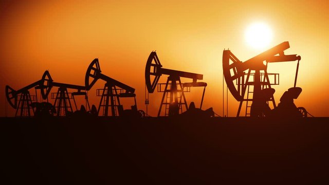 Oil Pumps in a Row at Sunset. Looped 3d animation. Technology and Industrial Concept. HD 1080.
