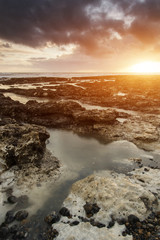Stunningrocky beach sunset landscape long exposure