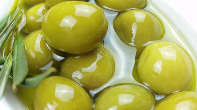 Olives inside olive oil, turning ,4K 