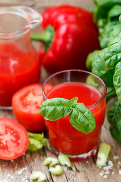 Tomato juice. Vegetable juice made of tomatoes, bell peppers, celery, Basil and spices