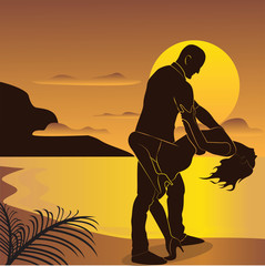 The dancing couple on the sunset background