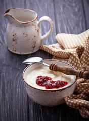 Sweet semolina porridge with raspberry jam