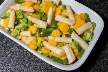 tasty casserole of green and white asparagus