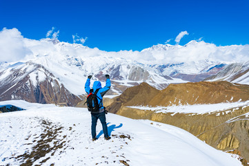 Trekking in Annapurna region, with Annapurna South in background, Nepal