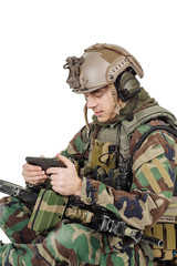 soldier wearing camouflage on his mobile cell phone.war, army, weapon, technology and people...