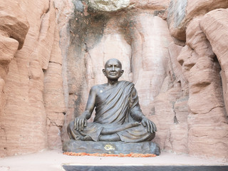 Stone gilded statue of Buddha