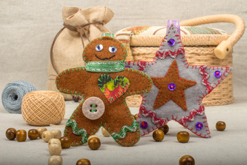 Handmade gray Christmas star and toy gingerbread man