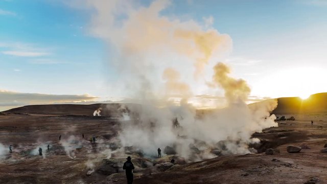 Geothermal fields with white steam flowing over the site in Bolivia