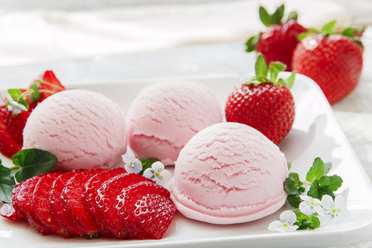 strawberry ice cream ball with fresh strawberries
