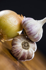 Onion Garlic and Ginger on Dark Background