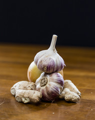 Onion Garlic and Ginger on Dark Background