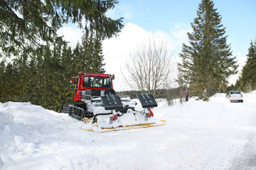 Cross-country skiing place with a piste bully at the side