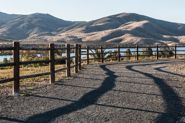 Pathway to lake and mountain range at Mountain Hawk Park in Chula Vista, California. 