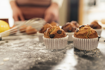 Beautiful woman Preparing Cookies And Muffins.