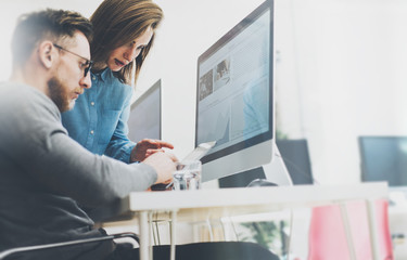 Coworking process, designers team working modern office.Photo young creative manager showing new...