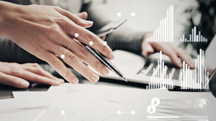 Closeup photo female hands with pen.Businessmans crew working bank investment project modern...