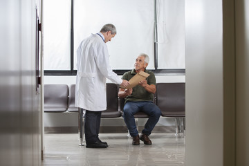 Doctor consulting with a senior man