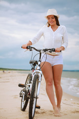 Fototapeta na wymiar Young girl on bicycle