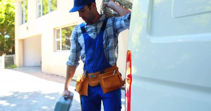 Handyman carrying tools