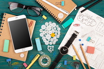 Idea concept - phone, watch, notepads, pencils and office suppli