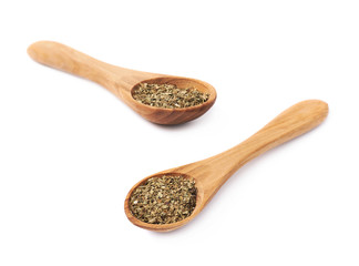 Wooden spoon and dried basil