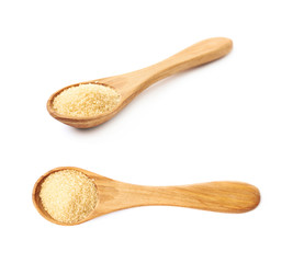 Spoon over pile of sugar