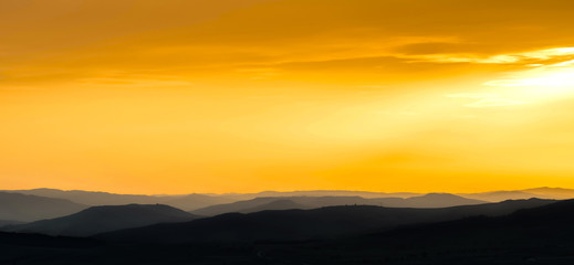 Fototapeta na wymiar mountains silhouette at sunset