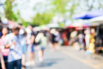 Blurred background : people shopping at market fair in sunny day - obrazy, fototapety, plakaty