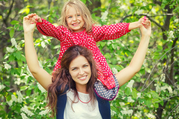 Outdoor portrait of mother and daughter
