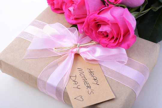 Brown Paper gift and pink roses.