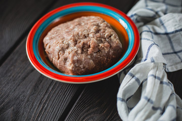 minced meat on wooden table