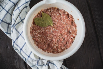 minced meat on wooden table