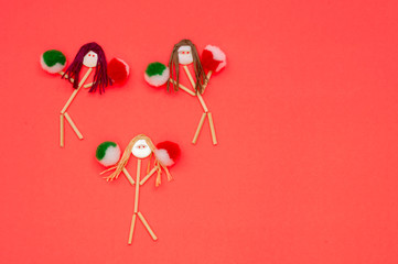 Cheerleader button head stick figures with green and red  pompoms 