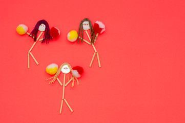 Cheerleader button head stick figures with yellow and red  pompoms 