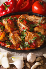 Tasty chicken stew with vegetables and ingredients close-up. vertical
