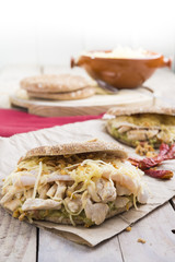 Sandwich with chickend and guacamole, cheese.