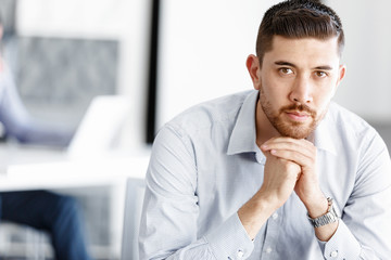 Fototapeta premium Attractive office worker sitting at desk