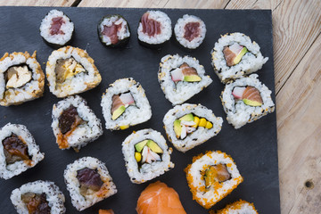 Sushi rolls on a slate plate