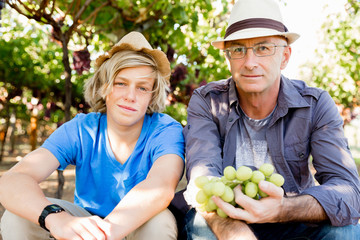 Father and son in vineyard