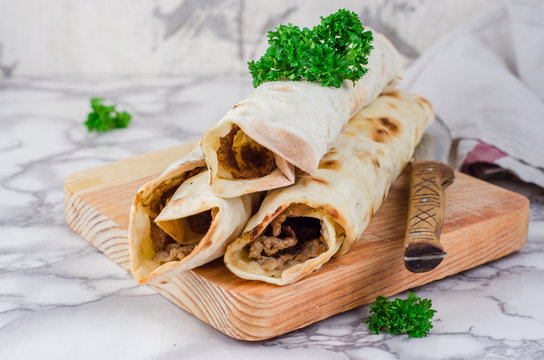 Lahmacun shape roll - turkish or arabian pizza with miced meat and spice