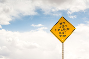 Naklejka premium When flooded turn around. Road sign
