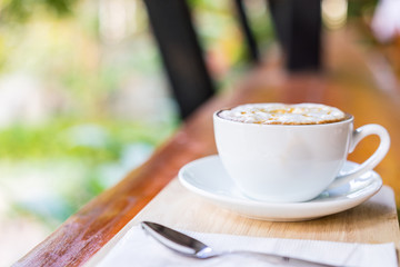 coffee cup on wooden table ,soft focus