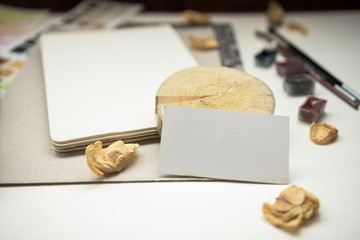 Mockup with watercolor paints, color palette and paint brushes. Cute vintage mock up.