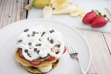 pancakes with strawberries, banana, blueberries and chocolate...
