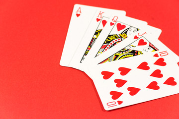 Playing cards on red background