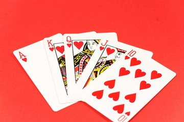 Playing cards on red background