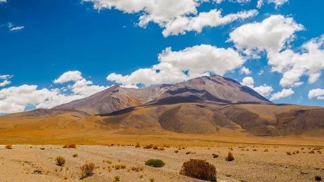 Clouds flow over the crater of dormant volcano in Bolivia Time lapse