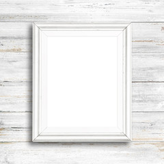 White picture frame on white wood wall.